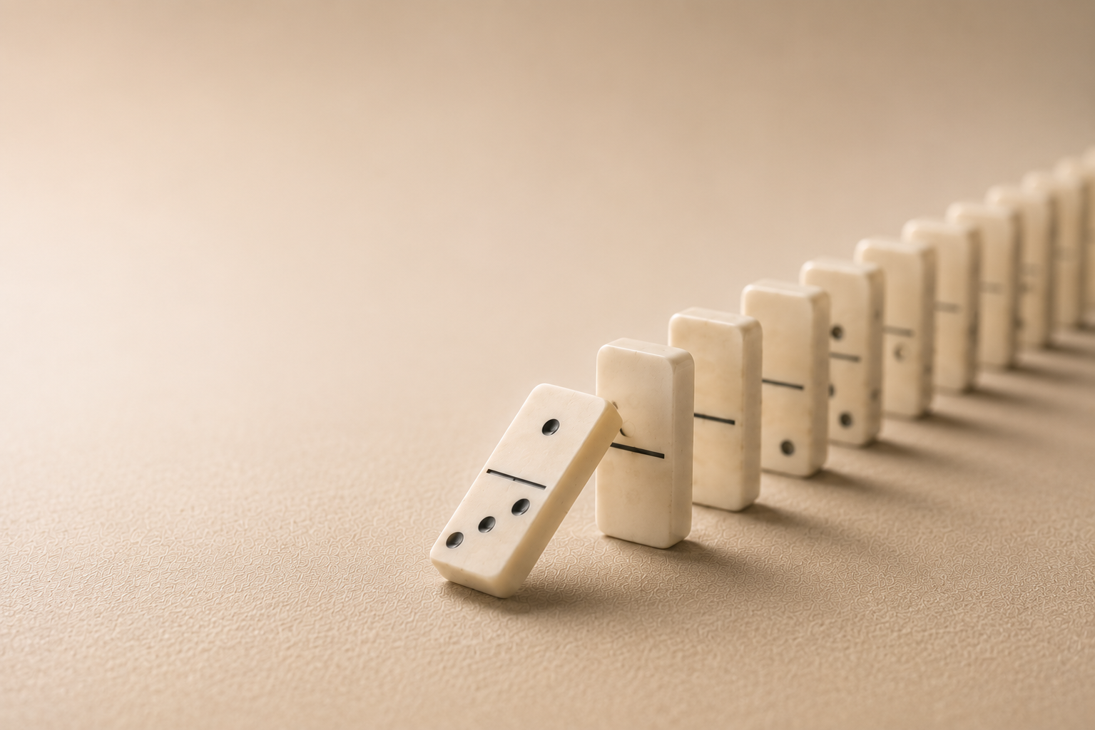 Image of cream dominoes falling